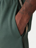 EA7 U Pantalone sportivo con banda laterale verde